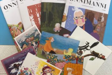 Onnimanni-lehtiä ja postikortteja.